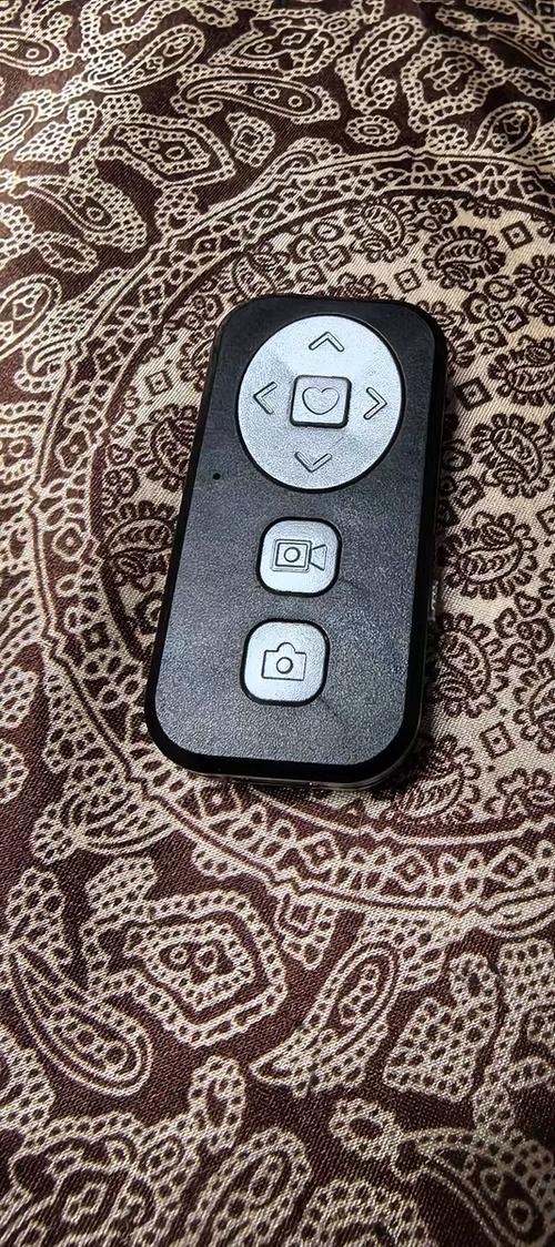 自拍蓝牙遥控器怎么用